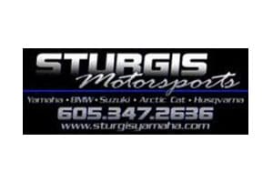 A motorcycle shop logo with the words sturgis motorsports in front of it.