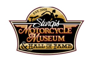 A logo of sturgis motorcycle museum and hall of fame.