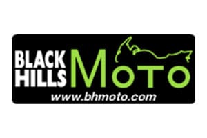 Black hills moto logo with a motorcycle in the background.